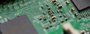 tilt-shift photography of green computer motherboard